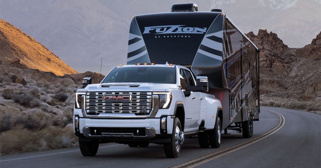 2025 GMC Sierra 2500 HD towing an RV trailer