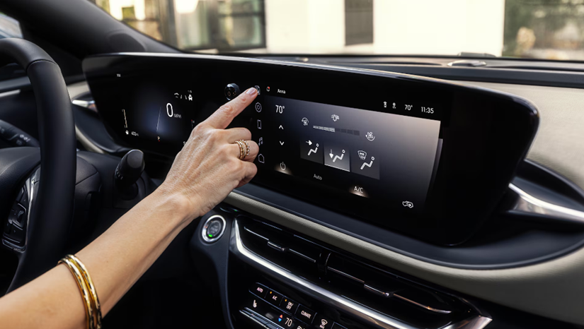 Person using the touchscreen in a car