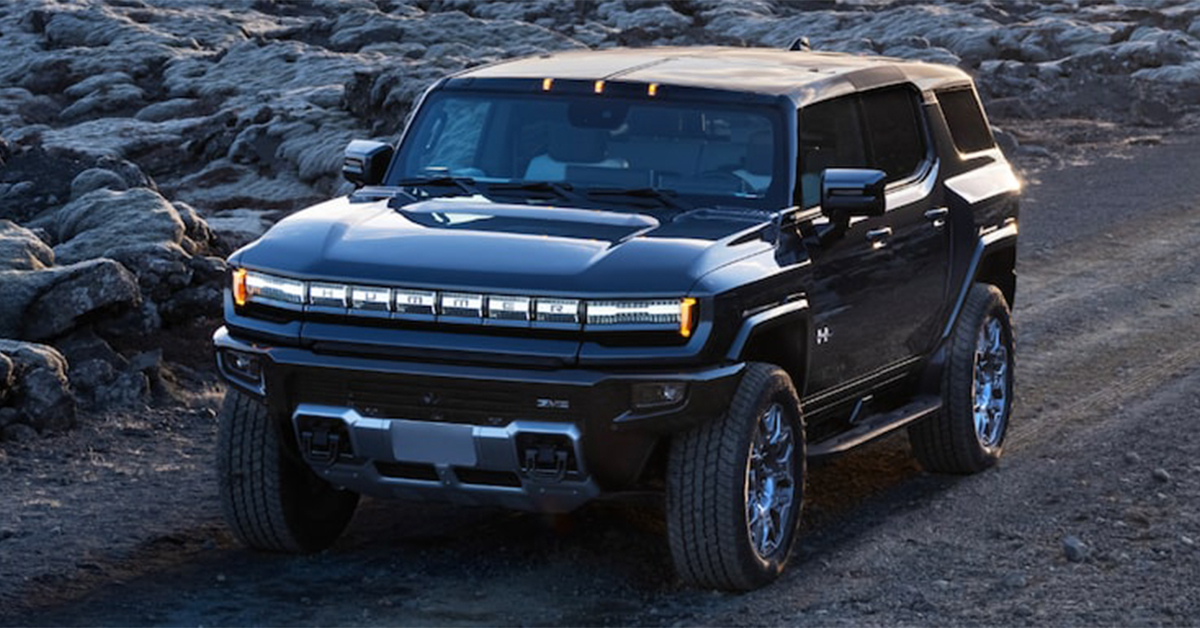 2025 Hummer EV SUV driving on a gravel road