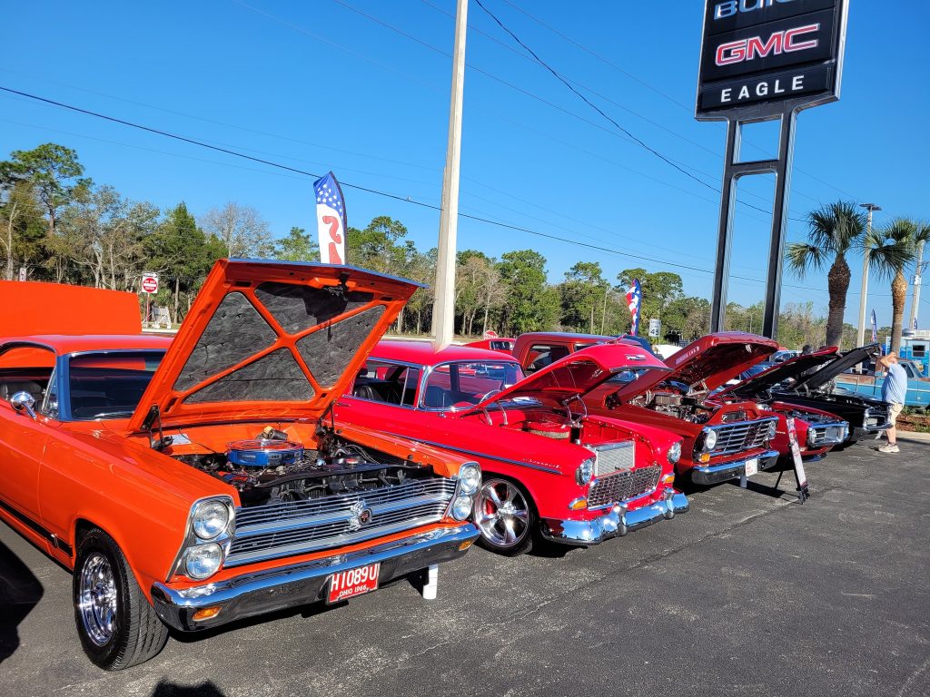 Row of classic cars at Eagle Buick GMC